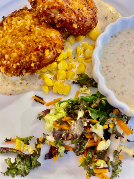istock Crab Cakes with salad background 1412722336