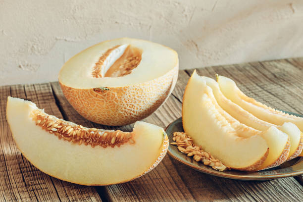 istock Sliced melon on wooden table 1412724898