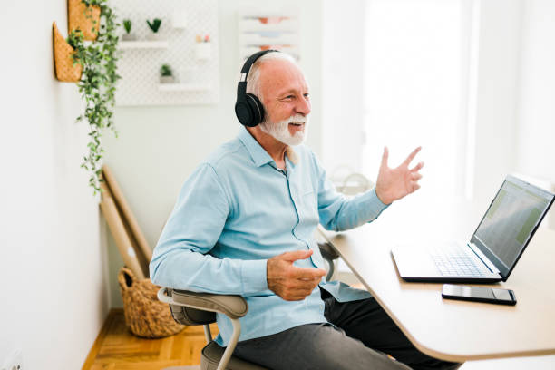 istock Man wear headphones watching webinar video course 1412727306