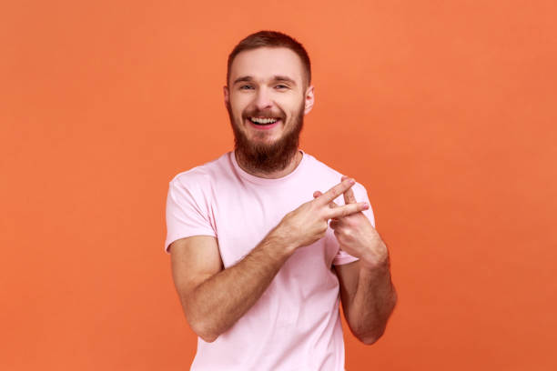 istock Hashtag gesture. Man crossing fingers, showing hash symbol, tagging famous internet message. 1412732458
