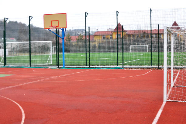istock Modern multifunctional playing sports with an artificial covering playground 1412732481