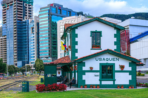 Bogotá, Colombia - June 13, 2013: The old colonial Usaquén Train Station from which the 'Tren Turistico' or translated, Tourist Train, departs every Saturday, Sunday and public holiday for the Sabana de Bogota; there are extensions to the trips in the Sabana, to either the Salt Cathedral in the halite mines at Zipaquirá or the salt mines in Nemocón. Image shows the train side.