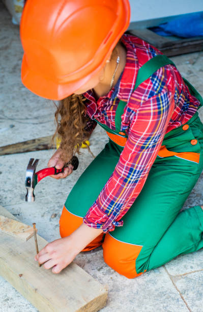 istock Tools for repair. future engineer. happy kid use hammer repairing tool. building construction site. child architect worker. labor day concept. childhood development. teenager girl assistant 1412732815