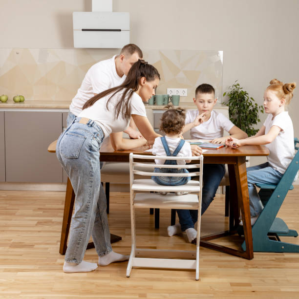 istock young family with three children in the kitchen 1412733206