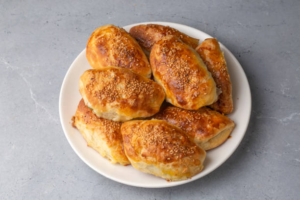istock Turkish cuisine; Handmade Cheese Pastry (Turkish name; peynirli pogaca) 1412735561