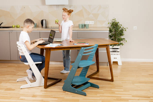 istock brother teaches lessons with his sister 1412736035