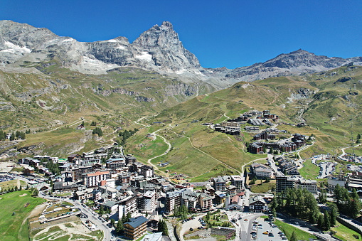 Panoramic view from above the village of Breuil-Cervinia with the Matterhorn in the background. Breuil-Cervinia, Italy - August 2022
