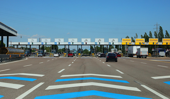 Mestre, VE, Italy - July 8, 2022: Exit Gates of an Italian Motorway and cars
