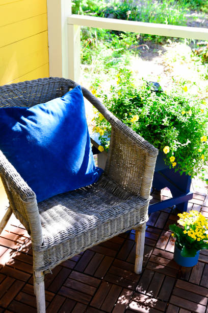 istock Old Wicker Chair and Blue Cushion 1412738972