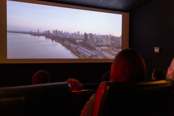 istock people from the back watching movie on cinema screen 1412739683