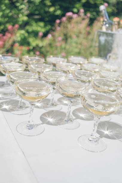 istock Banquet setting of filled champagne glasses 1412740237