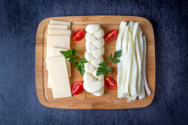istock Traditional various cheeses, string, knitted and cecil cheese, turkish delicatessen concept 1412741006
