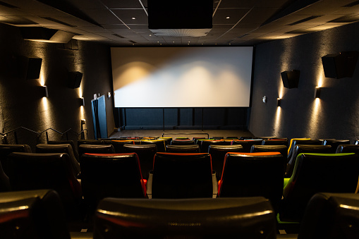 Cinema room with seats in various colors