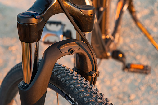 Close-up picture of a bicycle fork and a tire