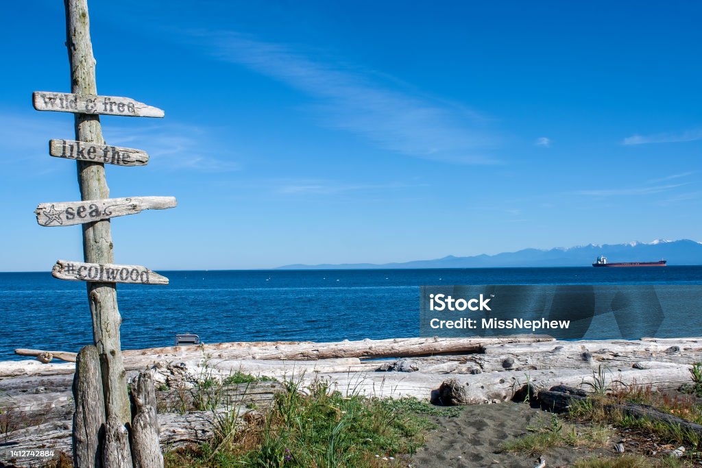 Sign on the beach in Esquimalt Lagoon, Colwood, British Columbia Beach Stock Photo