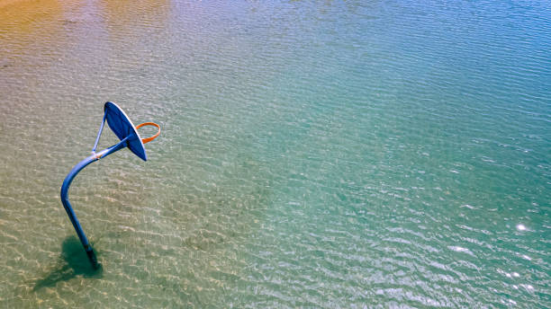 istock Shallow waters with a basketball hoop 1412743019