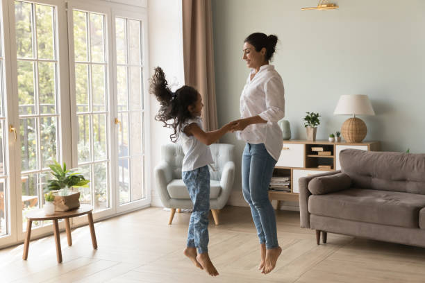 istock Excited Indian kid and happy mom holding hands 1412746843