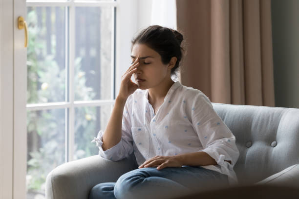 istock Depressed frustrated young Indian woman suffering from headache 1412746902