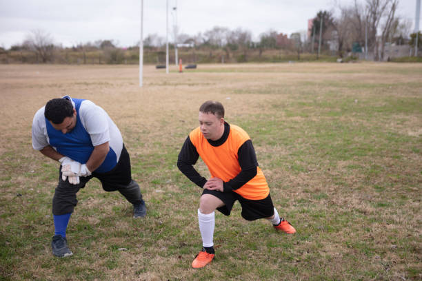 istock Mentally disabled soccer team warming up at field 1412752901