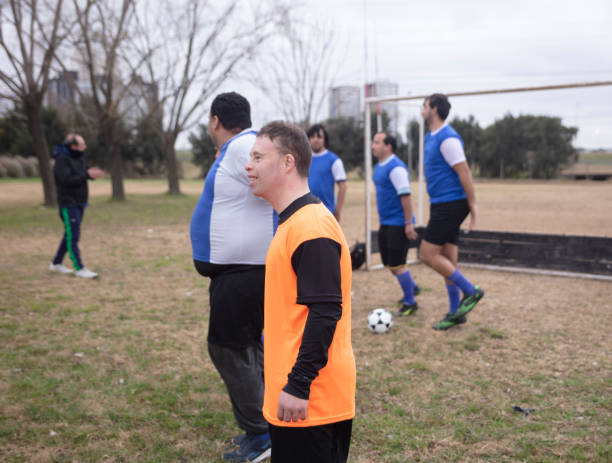 istock Mentally disabled soccer team warming up at field 1412752919