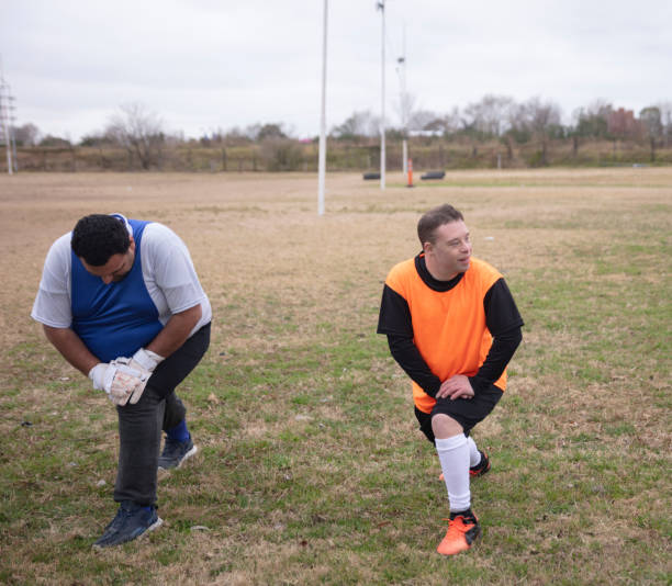 istock Mentally disabled soccer team warming up at field 1412752927