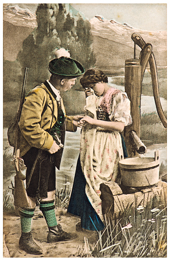 Couple in typical bavarian dress. Vintage german postcard