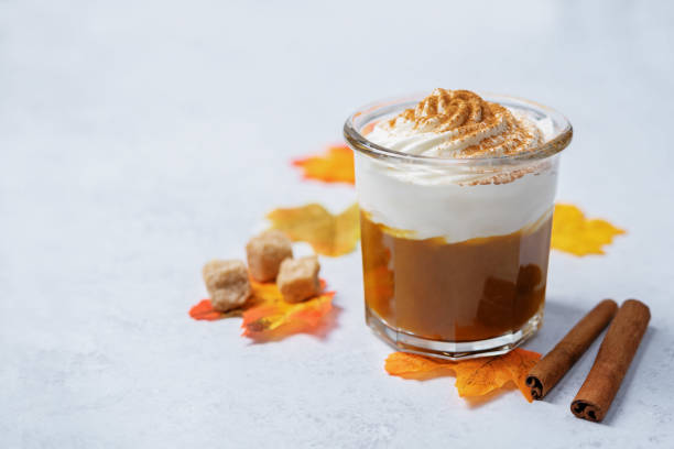 istock Pumpkin spiced Latte Coffee with whipped cream in a glass 1412753941