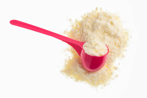 istock Powdered milk with nutrients in the pink spoon 1412756638