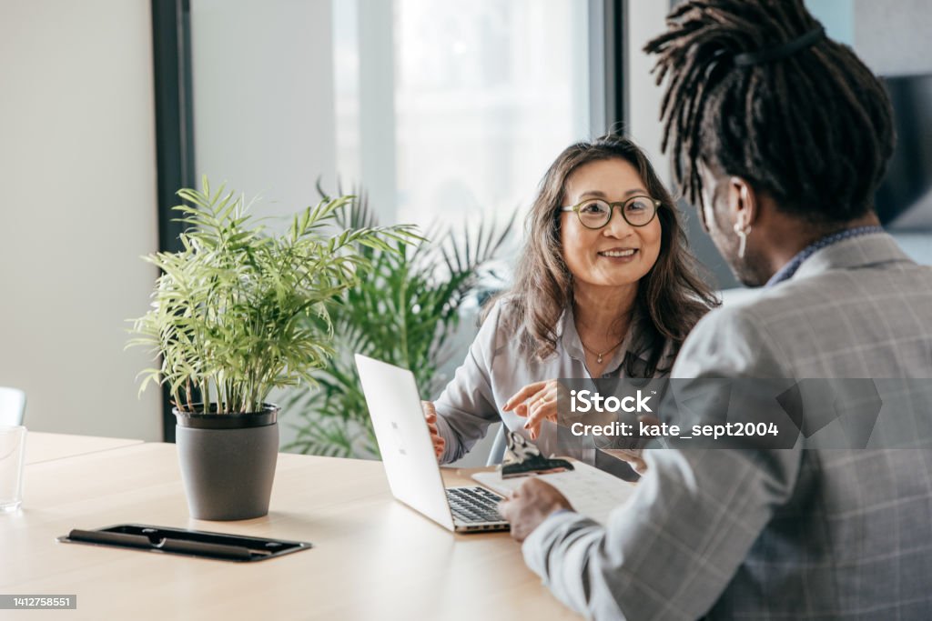 Tutoring in person Two people in the office Business Meeting Stock Photo