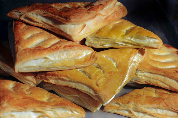 istock Freshly baked croissants with ham and cheese on a plate 1412762441