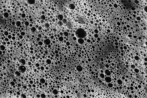 istock Sea foam scum on ocean water texture 1412766180