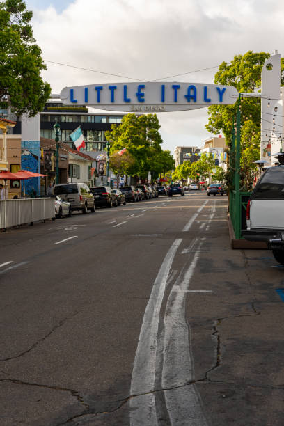 the little italy sign welcomes visitors to this downtown area. - marquis imagens e fotografias de stock