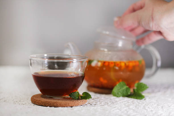 istock tea with sea buckthorn and mint on a light background 1412768336