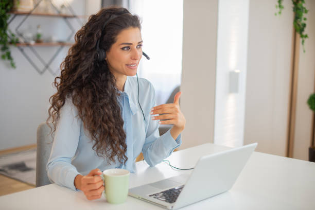 istock Young call center agent working in an office 1412771494