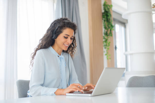 istock Young call center agent working in an office 1412771499