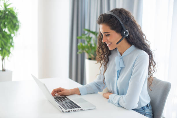 istock Young call center agent working in an office 1412771510