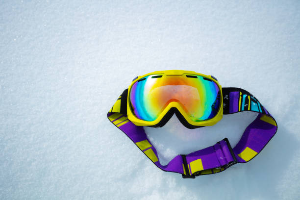 istock Yellow ski mask in snow from above - alpine vacation concept 1412772589