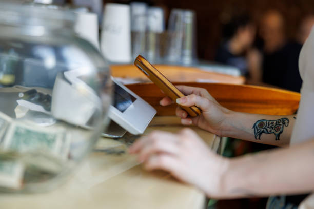 istock Mobile contactless payment with smartphone at the payment terminal. 1412774942