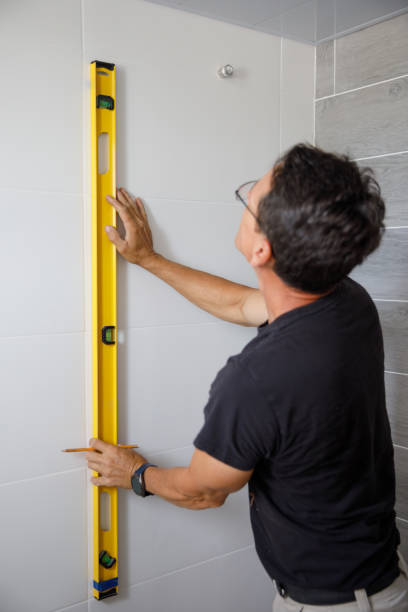 istock A man is doing repairs in the bathroom. 1412779625