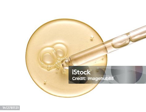 istock Cosmetic serum gel beauty drop and cosmetic pipette on white background. Skincare beauty product with bubbles texture. 1412781131