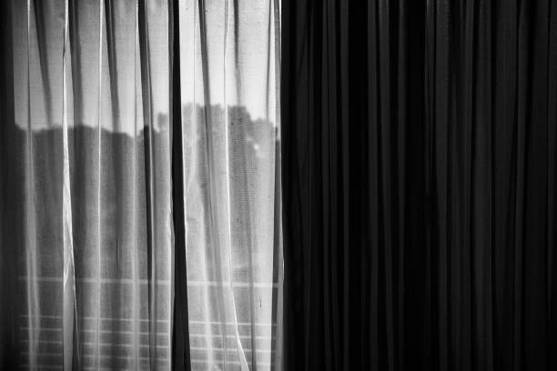 istock Image of the view behind closed curtains and lace curtains 1412781456