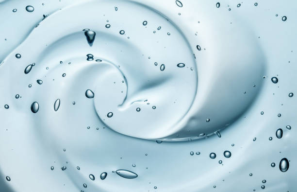 Liquid gel beauty serum texture. Beauty skincare liquid blue gel background with bubbles.Skincare hygiene product closeup. stock photo