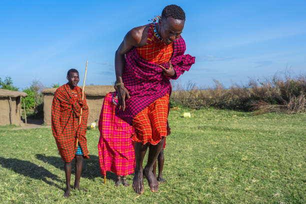 istock Maasai Mara man showing traditional Maasai jumping dance 1412783122
