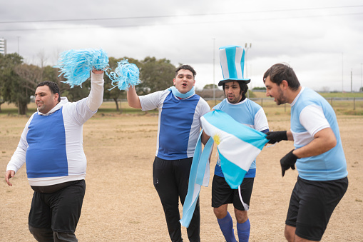 A group of mentally disabled argentine young people celebrating during soccer competition