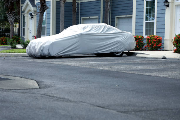 istock Covered car in residential parking lot 1412792006