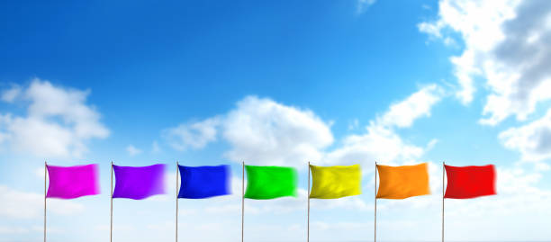 istock Gay pride rainbow colors blank flags over sunny sky 1412792066