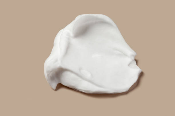 istock Shaving cream isolated on brown color background. 1412793162