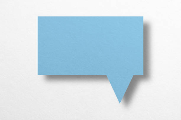 istock Speech balloon shaped blue paper isolated on white background. 1412797035