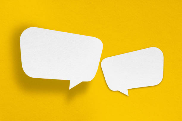 istock speech balloon shape white paper isolated on yellow background 1412797042