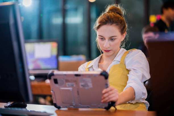 istock attractive creative female relax casual working with tablet searching for more case study for her new project in modern office interior,Young businesswoman using digital tablet in office 1412797883